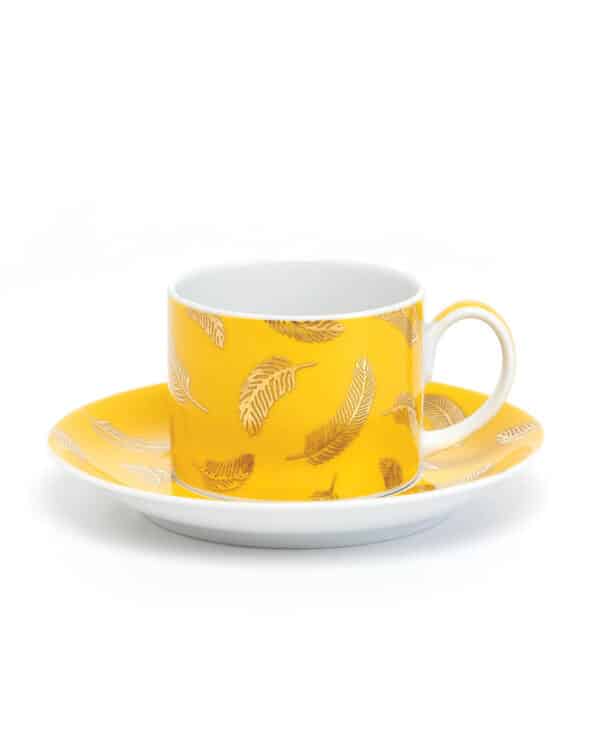 Yellow cup with a saucer