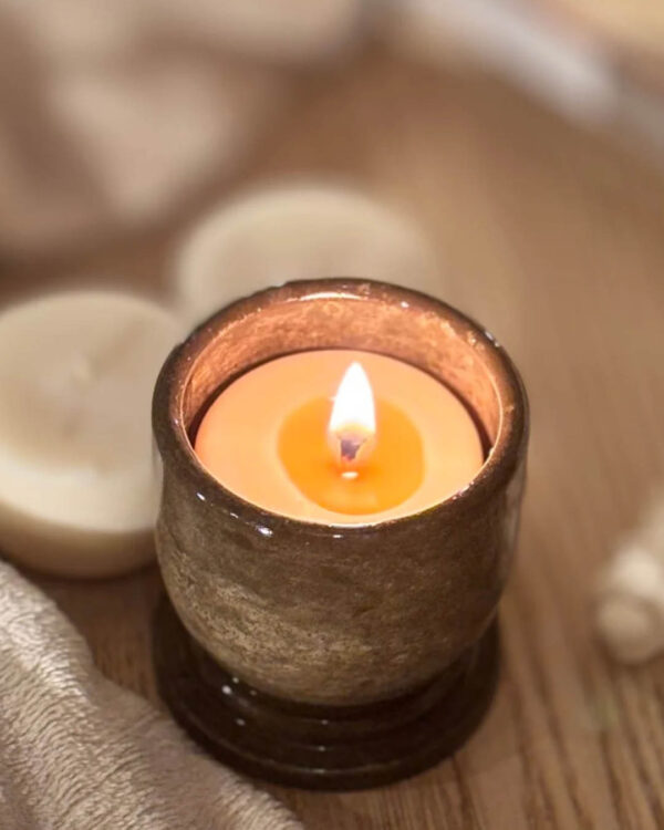 Small Serin candle in a concrete holder