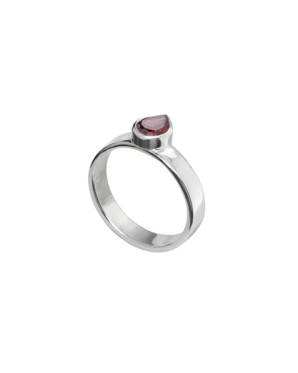 Off centre garnet ring